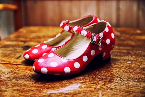 Red dance shoes with white dots