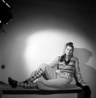 Fashion of 1946. A woman pictured wearing the typical fashion of the postwar era. She is dressed in