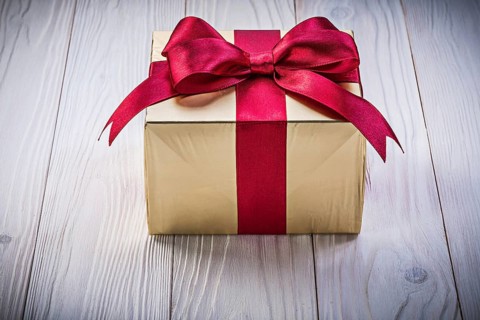 Birthday gift box on wooden board holidays concept