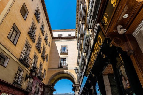 Madrid, Spain, June 1, 2019: Toledo Street near Plaza Mayor. Low angle view of old buildings,