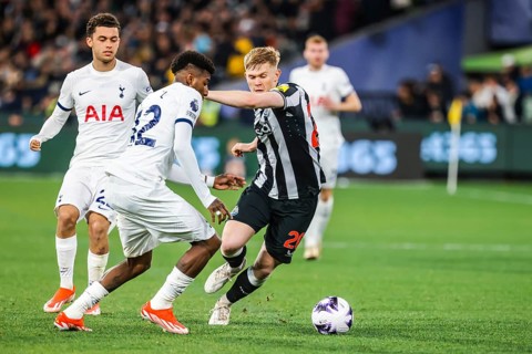 MELBOURNE, AUSTRALIA, MAY 22: Emerson Royal of Tottenham Hotspur and Lewis Hall of Newcastle United