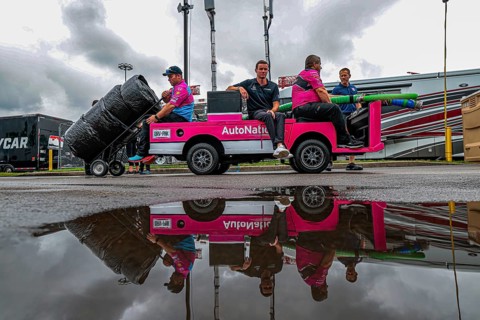 Crew members of Andretti Autosport Honda prepare their race car for the Big Machine Music City