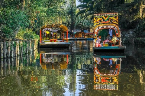 Mexico City, Mexico. Jan 11, 2024. A couple of Trajinera a gondola style boats, or colourful rafts