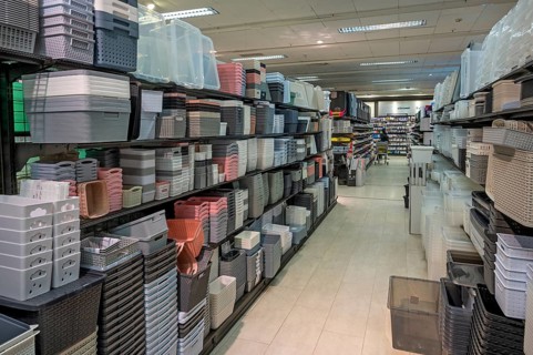 Shelves with plastic baskets, one-euro shop, Allgäu, Bavaria, Germany, Europe