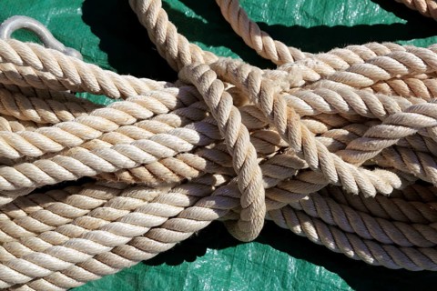 Marine clear white rope over green background