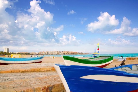 Beach of Salou with beached boats in Tarragona Catalonia Spain