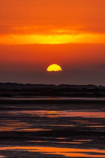Beautiful golden coloured sunset at the seaside on the Isle Borkum