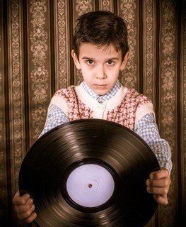 Child hold lp. Vontage clothes
