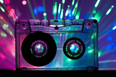 Transparent Cassette tape and blue pink color disco light background