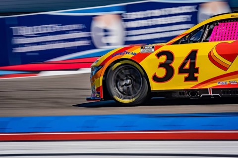NASCAR Cup Series driver, MICHAEL MCDOWELL (34), races through the turns during a practice session
