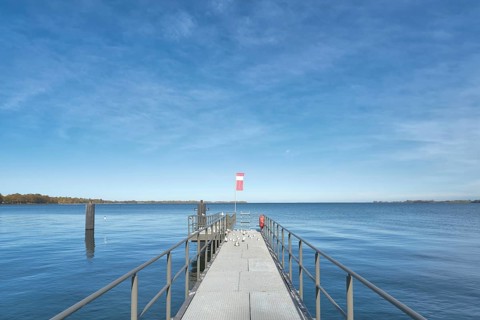 Boat landing stage with a view of the water in the Strelasund in Stralsund, Germany, Europe