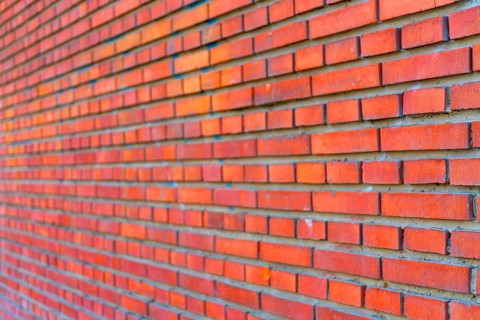The background of the old red brick wall for design interior and various scenes or as a background