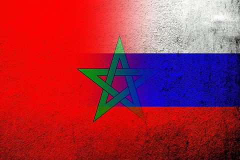 National flag of Russian Federation with The Kingdom of Morocco National flag. Grunge background
