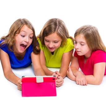 Sisters cousins kid girls with tech tablet pc playing happy lying on white background