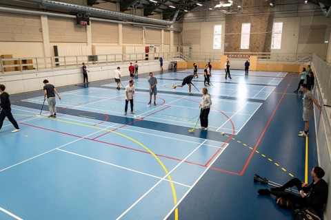 February 21, 2019. Denmark. Copenhagen. Team game with stick and ball Floorball or hockey in hall.