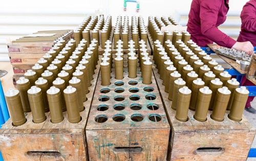 RPG explosive elements of anti tank rocket-propelled grenades (RPGs, bazooka) near an assembly line