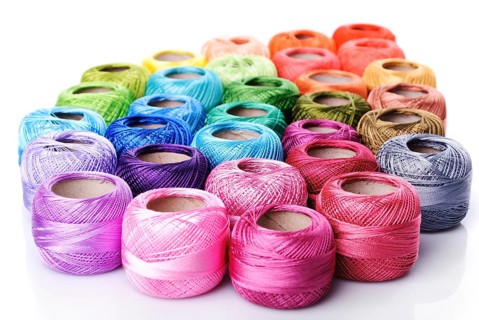 Color thread heap isolated on white