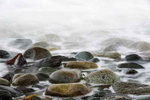 Returning ocean tide on a rocky coast on Quadra Island in Canada