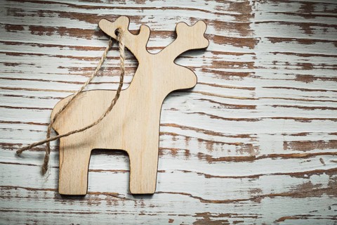 Vintage wooden deer string on wood board celebrations concept