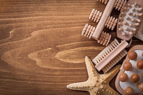 Wisp of bast back massagers starfish and brush on pine vintage board healthcare concept