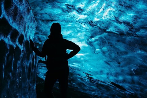 Human features on the background of ice cave in Iceland
