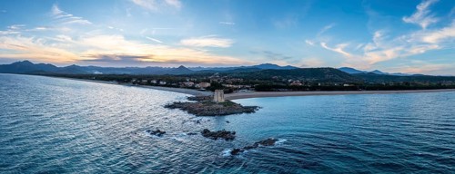 An aerial panorama landscape of the Torre di Barisardo beach on the east coast of Sardinia at dusk