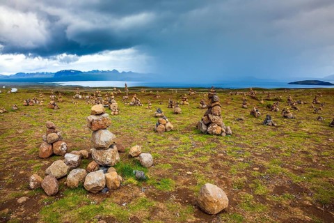 Stone pyramids bring good luck in the journey. The stone pyramids are a symbol of Iceland. Field of
