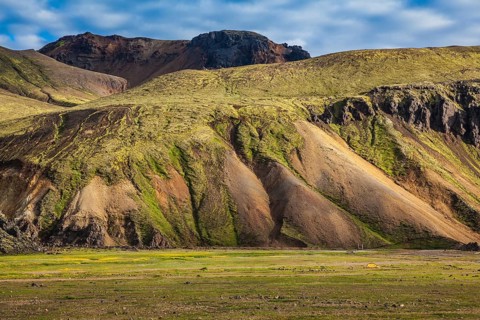 Multicolored rhyolite mountains surround the valley. Summer morning in the National Park