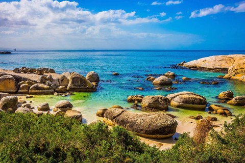 Huge boulders on the beach of the Atlantic Ocean. Boulders Penguin Colony in the Table Mountain