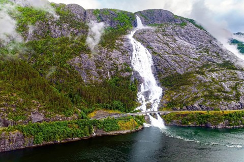Langfossen is a magnificent cascading waterfal on the Vaule River. Passes through the highway.