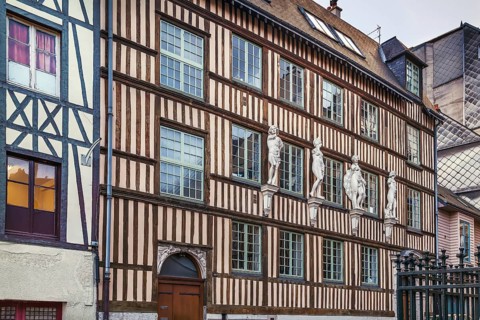 Historical half-timbered house with sculpture in Rouen, France, Europe