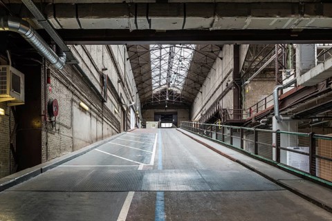 Brussels, Belgium, 05 23 2018: Industrial garage hall of the Kanal Centre Pompidou, now a museum,