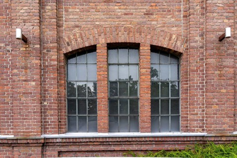 Windows of an 100 years old industrial brick building