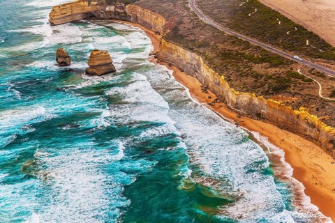 Australia. The Twelve Apostles is a group of limestone cliffs in the ocean near the coast in Port