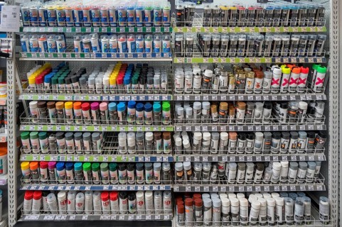 Shelf with spray paint cans in a DIY store, Allgäu, Swabia, Bavaria, Germany, Europe