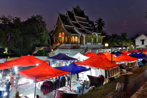 Night market in front of the Buddhist temple Haw Phra Bang of the Royal Palace, National Museum on