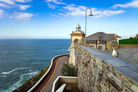 The majestic Atlantic Ocean. Asturias. Romantic trip to Spain. Beautiful road to lighthouse and
