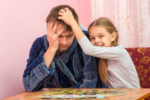 Daughter fun soothes tired dad who collect puzzles