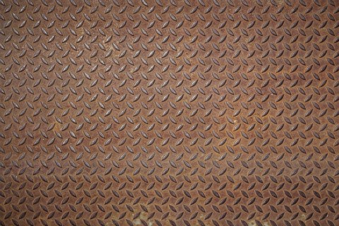 Front view of a rusty panel with non-slip surface
