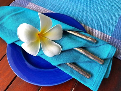 Food decoration with white plumeria rubra flower, Sri Lanka. Blue food decoration