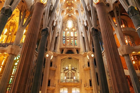 Barcelona, Spain - 15 December 2019: Sagrada Familia interiors - columns, vaults, stained glass and