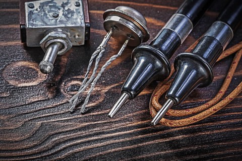 Set of vintage electric equipment on wooden board electricity concept