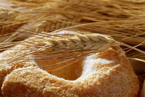 Delicious roll bakery with sugar and wheat ear spikes