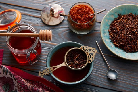 Kukicha tea served in bowl on wooden table board
