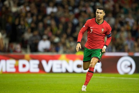 Football match, captain Cristiano RONALDO CR7 Portugal with broken running step to the left with