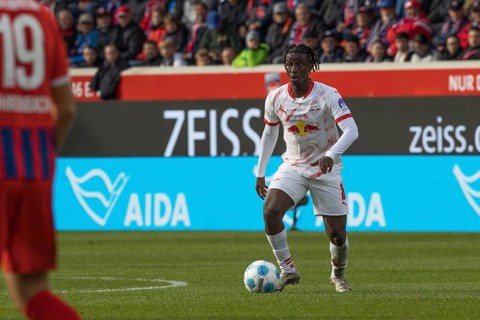 Football match, Amadou HAIDARA RB Leipzig concentrating on the ball looking to the left,