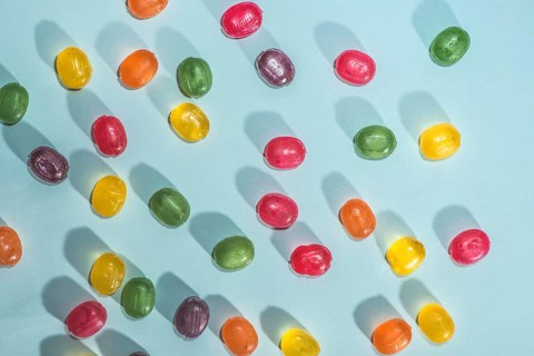 Candy scattered on the wooden table