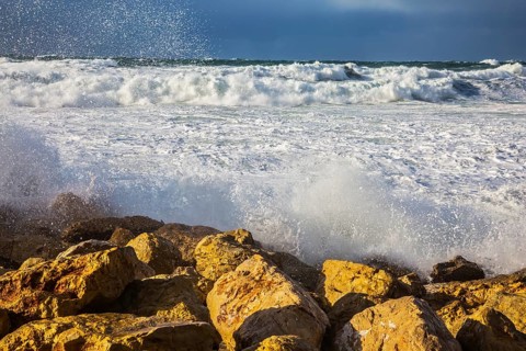 New Quay in the Old Jaffa in a winter storm. Huge foaming waves of the Mediterranean beat against