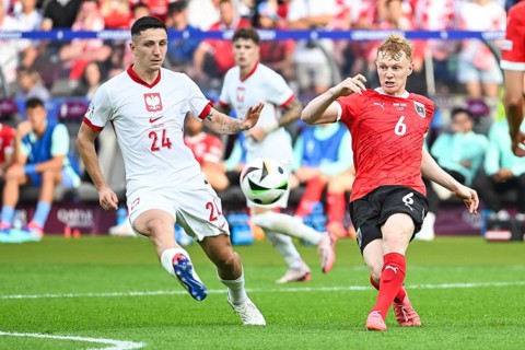 BERLIN, GERMANY - JUNE 21, 2024: Euro 2024 Groupe D match Poland vs Austria 1:3. Bartosz Slisz (L)