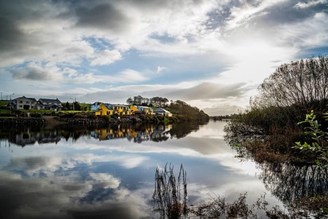 Beautiful reflections on river at morning in Killorglin in the wild atlantic way of Ireland